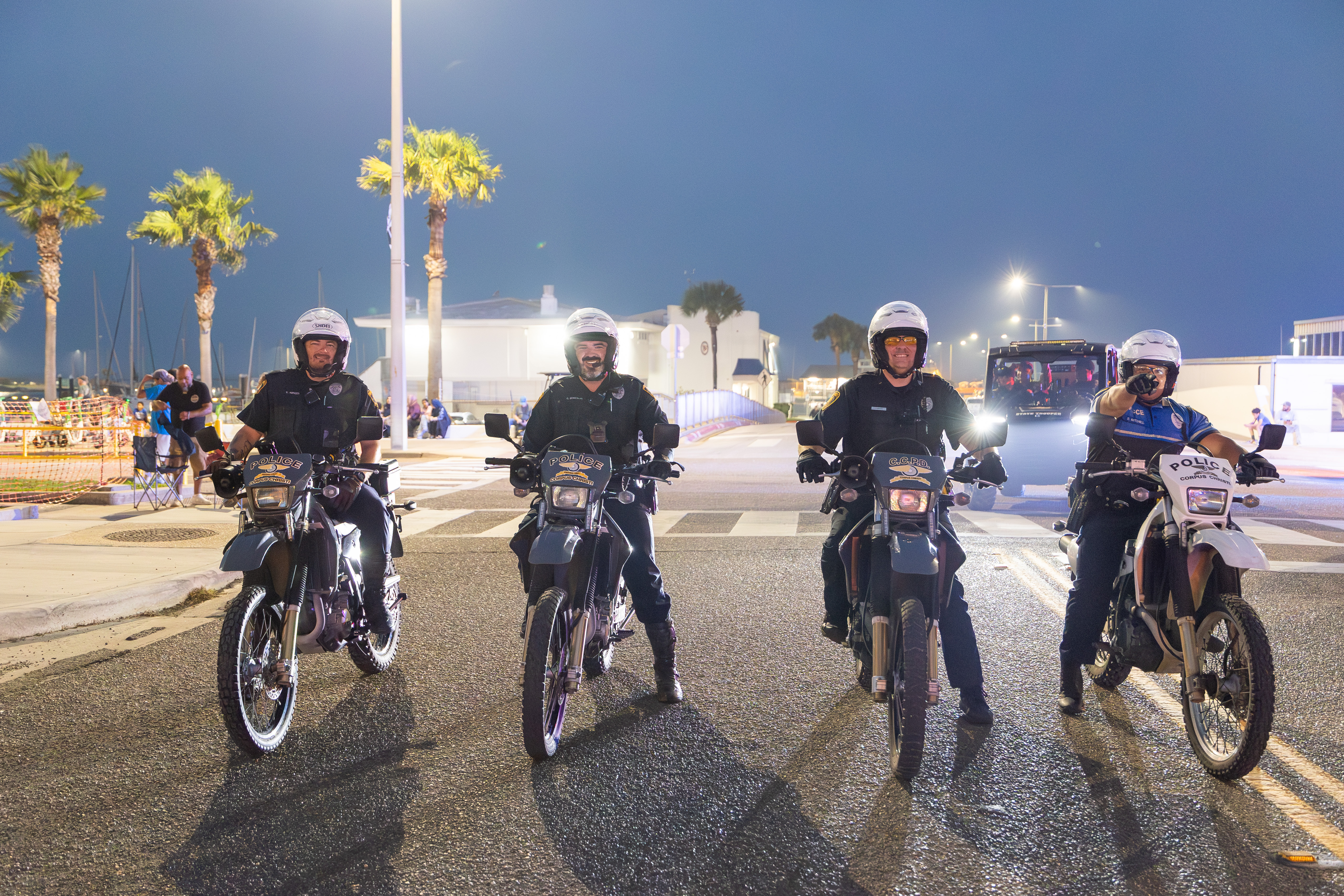 four police officers on motorcycles