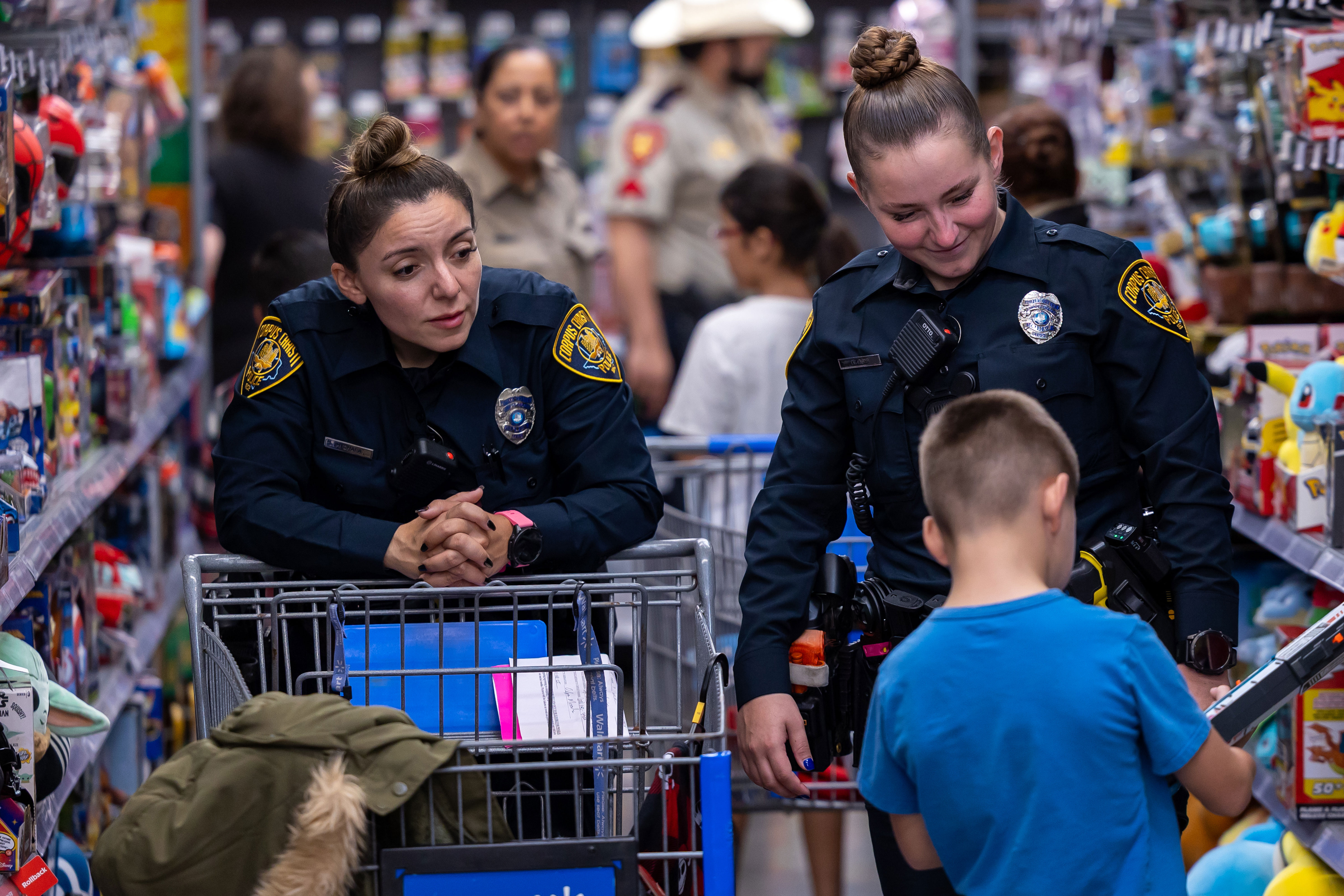 students at Shop with a Cop event pose with Chief Markle